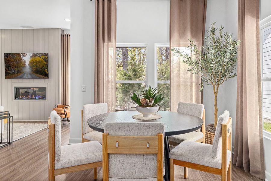 A room with a table and chairs.