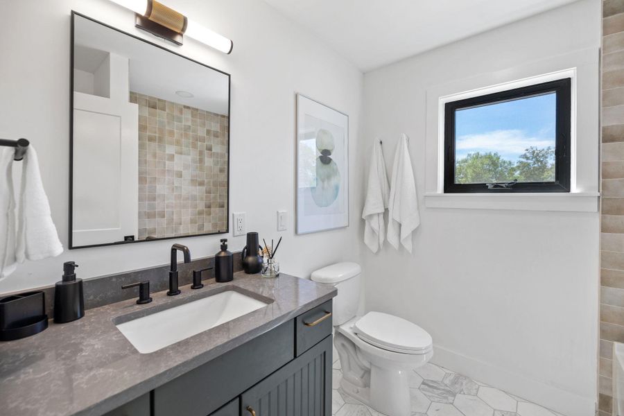 Bathroom with vanity and light tile patterned floors