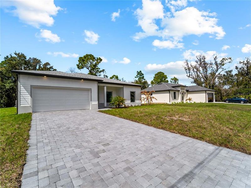 Exterior details and patio area of a home in , North Port (Image 32).