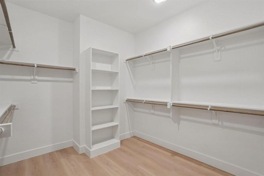 Primary bedroom walk-in closet