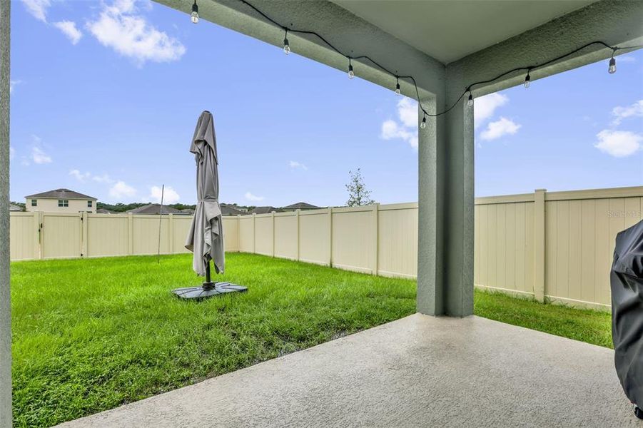 Exterior details and patio area of a home in Timberwalk, Mount Dora (Image 26).
