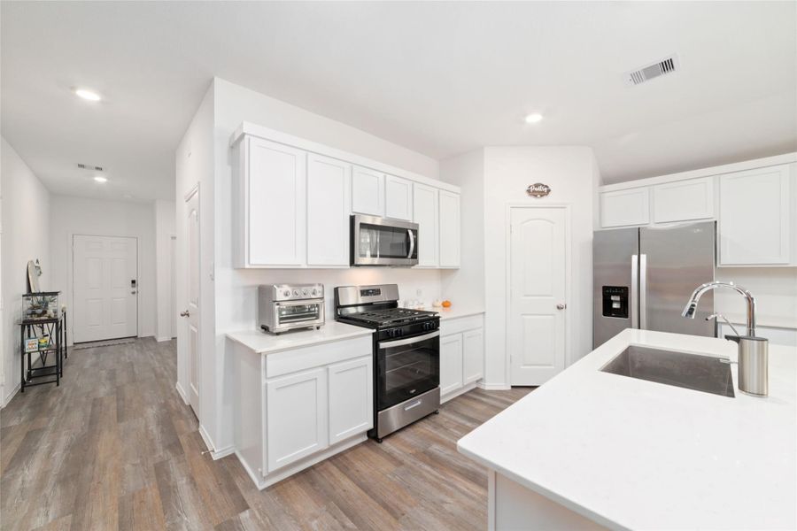 Furnished interior view inside a new home in Sunterra, Katy (Image 16).