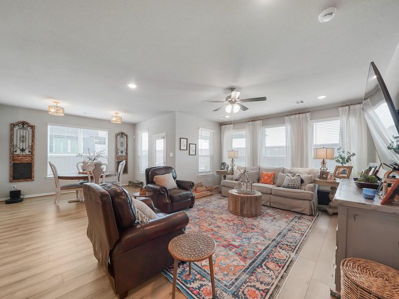 The living room offers an open, airy feel with generous space for comfortable seating and effortless flow from the kitchen and dining areas.