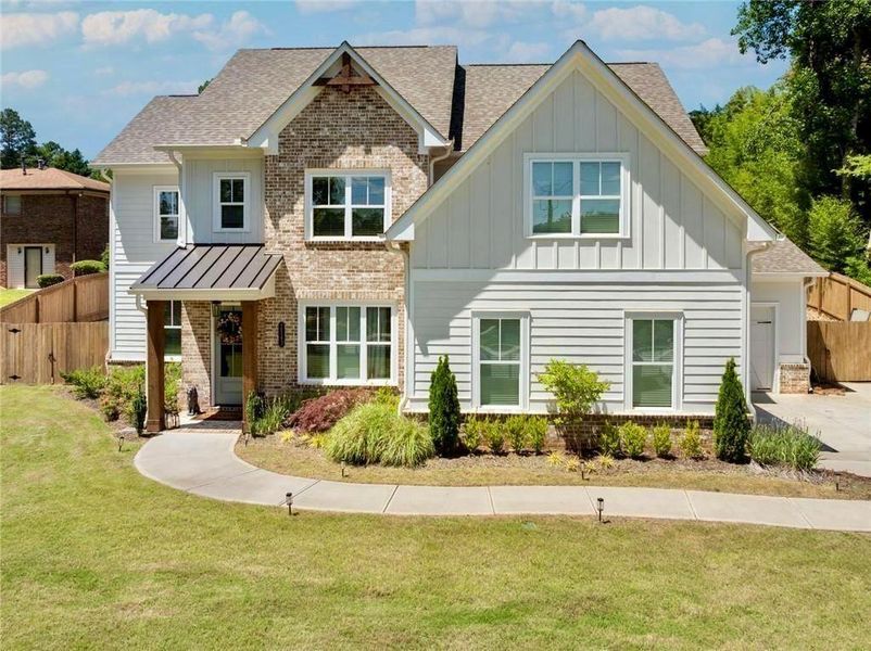 Front exterior of a new home in , Marietta, GA, highlighting curb appeal (Image 27).