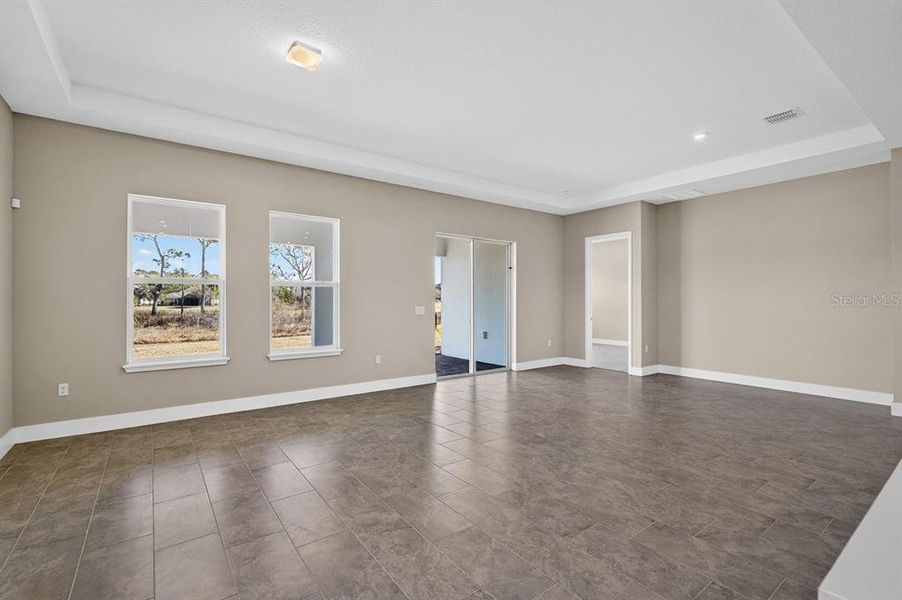 Spacious, unfurnished interior of a new home in Gray Hawk at Hole Two, Daytona Beach (Image 49).