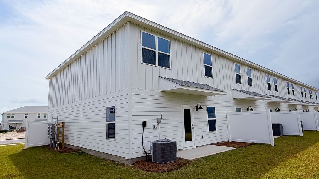 Exterior details and patio area of a home in Salt Creek Townhomes at Mexico Beach, Mexico Beach (Image 3).