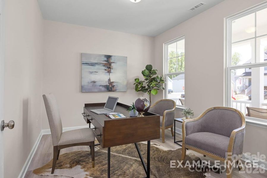 Sample furnished study off of foyer (has glass French Doors)