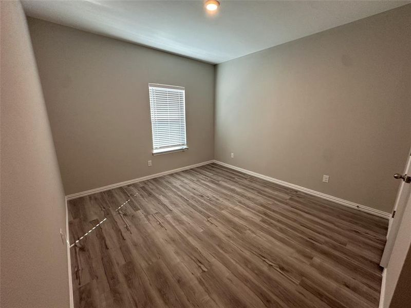 Spare room featuring hardwood / wood-style flooring