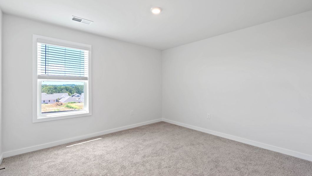 Spacious, unfurnished interior of a new home in Adams Glen, Greenville (Image 29).
