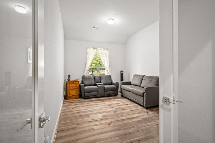 This is a bright, modern room that could be used an office/study, media room or 4th bedroom.