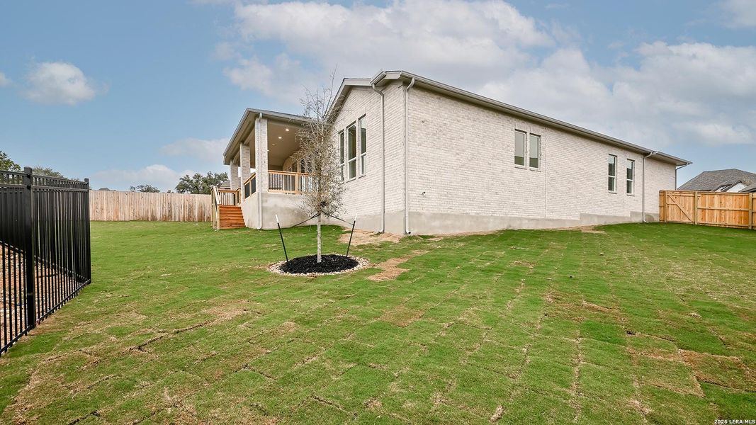 Exterior details and patio area of a home in Johnson Ranch 55', Bulverde (Image 3).
