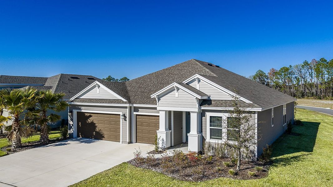 Front exterior of a new home in Colbert Landings, Palm Coast, FL, highlighting curb appeal (Image 17).