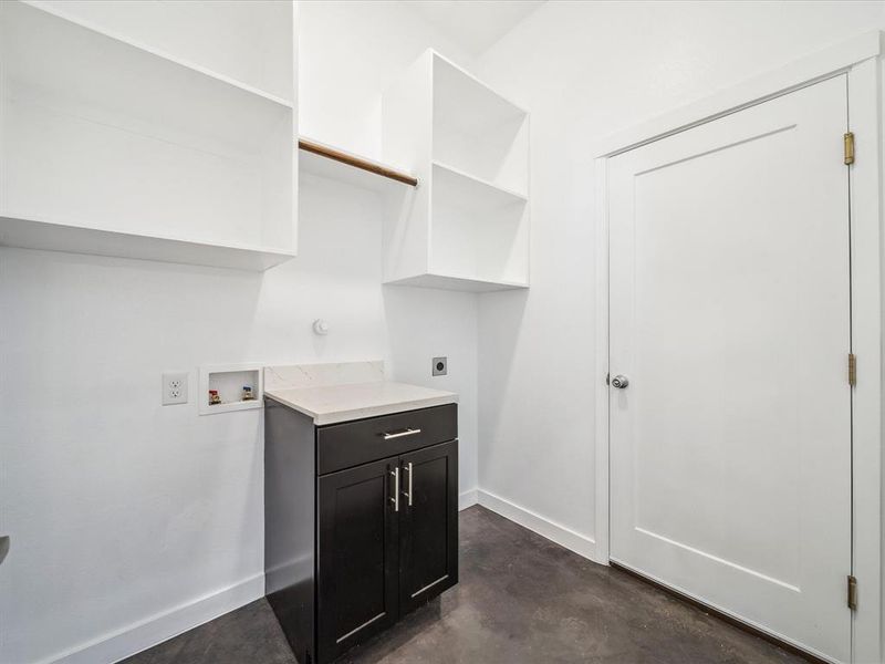 Laundry room with cabinets, hookup for a washing machine, and electric dryer hookup