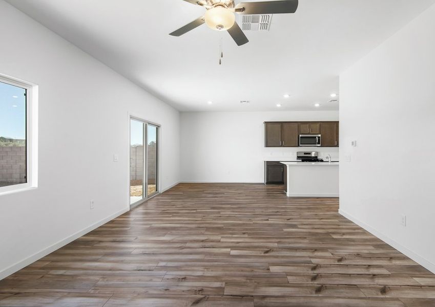 The kitchen and living room areas are a spacious open layout opening up to the back patio.