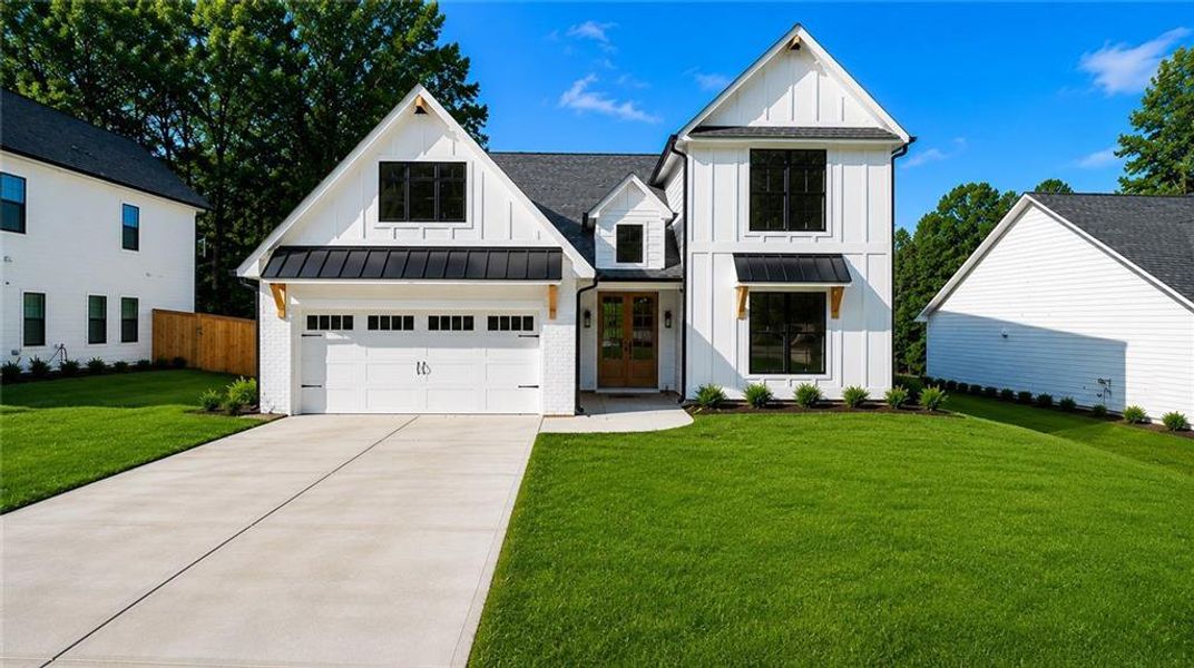 Front exterior of a new home in , Sugar Hill, GA, highlighting curb appeal (Image 1). Front exterior of a new home in , Sugar Hill, GA, highlighting curb appeal (Image 1).