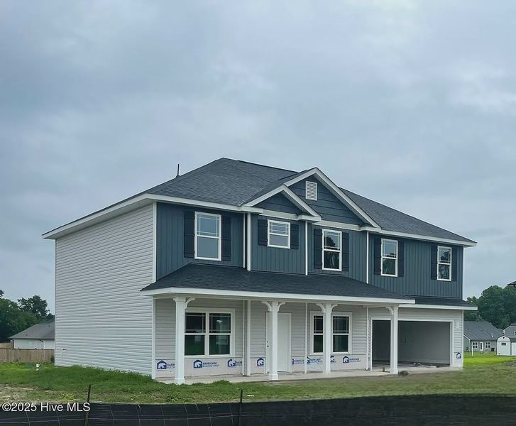 Front exterior of a new home in Williams Grove, Bailey, NC, highlighting curb appeal (Image 1). Front exterior of a new home in Williams Grove, Bailey, NC, highlighting curb appeal (Image 1).