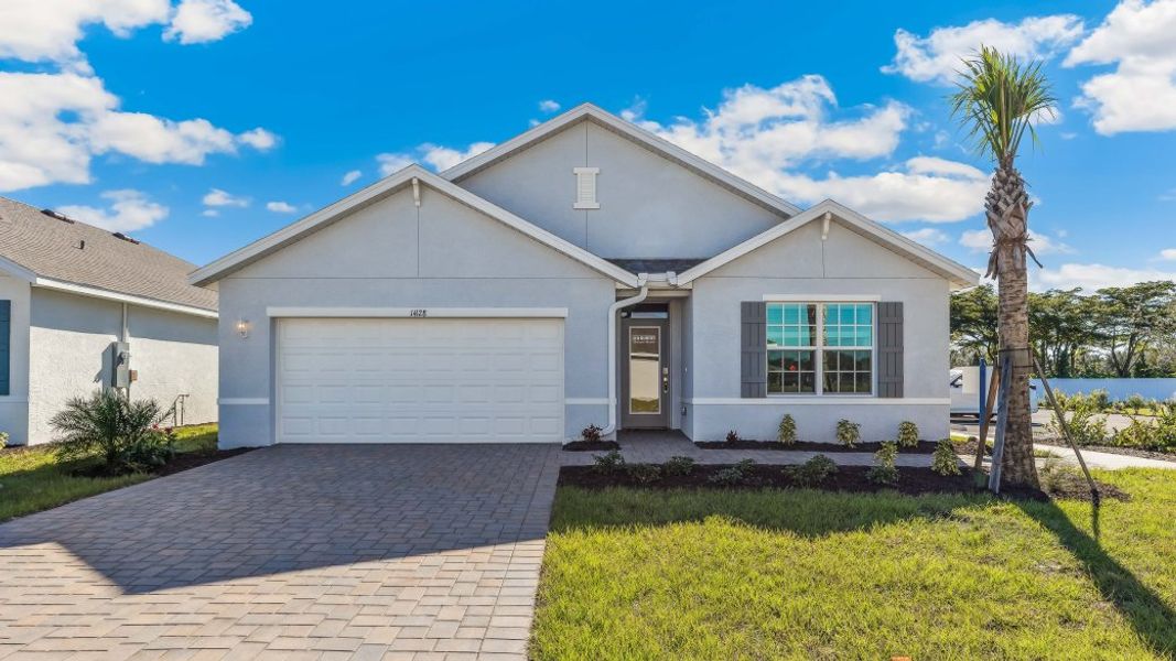 Front exterior of a new home in LaBelle Homes, Labelle, FL, highlighting curb appeal (Image 1). Front exterior of a new home in LaBelle Homes, Labelle, FL, highlighting curb appeal (Image 1).