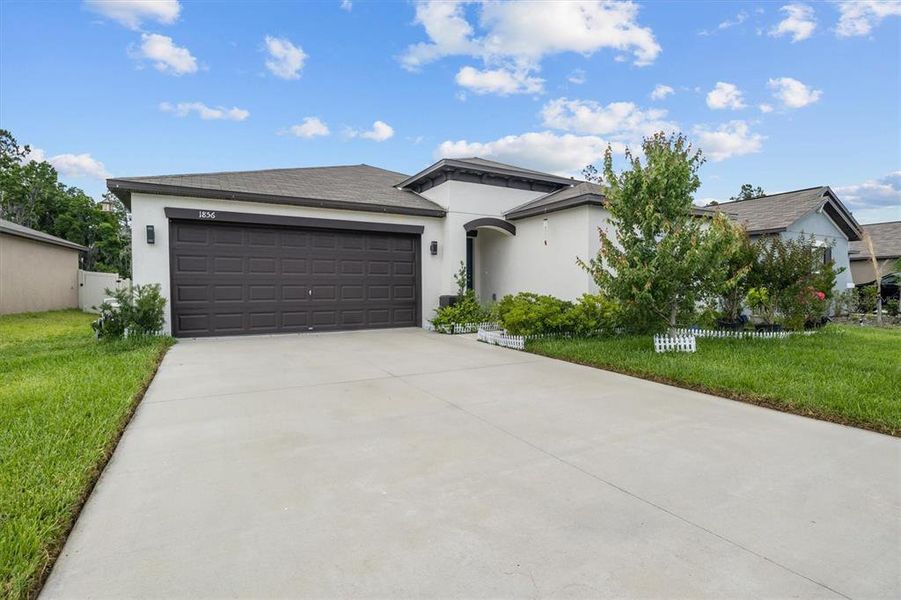 Front exterior of a new home in , Lakeland, FL, highlighting curb appeal (Image 23). Front exterior of a new home in , Lakeland, FL, highlighting curb appeal (Image 23).