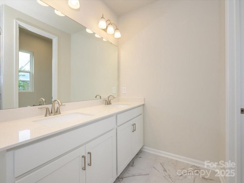 Dual vanity en suite bath so you never have to worry about storage. Dual vanity en suite bath so you never have to worry about storage.