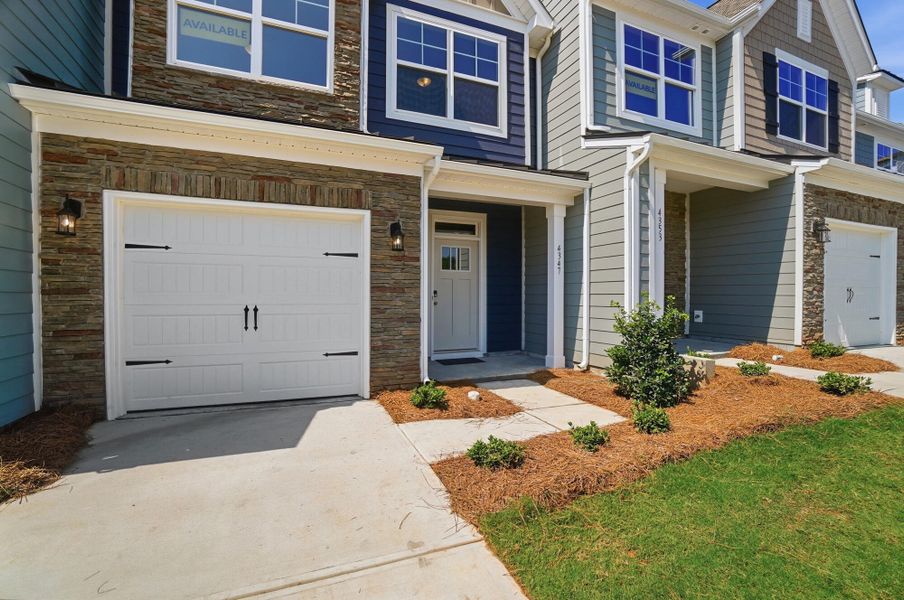 Exterior details and patio area of a home in Harrisburg Village Townhomes, Harrisburg (Image 2).