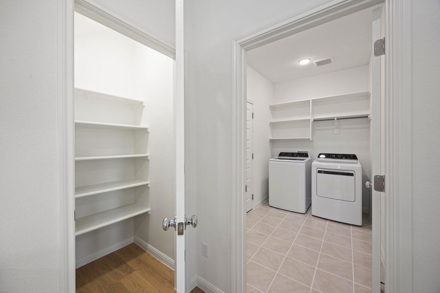 Pantry and Utility Room in the Magnolia home plan by Trophy Signature Homes – REPRESENTATIVE PHOTO