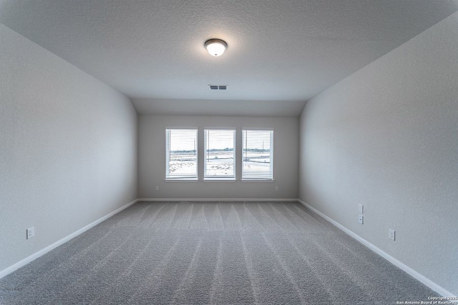 Spacious, unfurnished interior of a new home in The Woodlands at Medina Hills, Mico (Image 20).