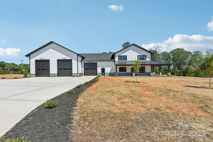 Front exterior of a new home in , Mooresville, NC, highlighting curb appeal (Image 23). Front exterior of a new home in , Mooresville, NC, highlighting curb appeal (Image 23).
