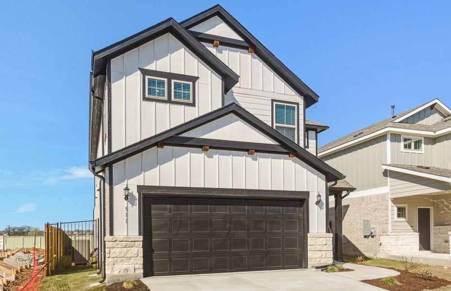 Front exterior of a new home in Santa Rita Ranch, Liberty Hill, TX, highlighting curb appeal (Image 17).
