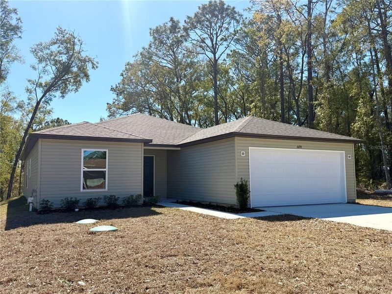Front exterior of a new home in Inverness, Inverness, FL, highlighting curb appeal (Image 24).