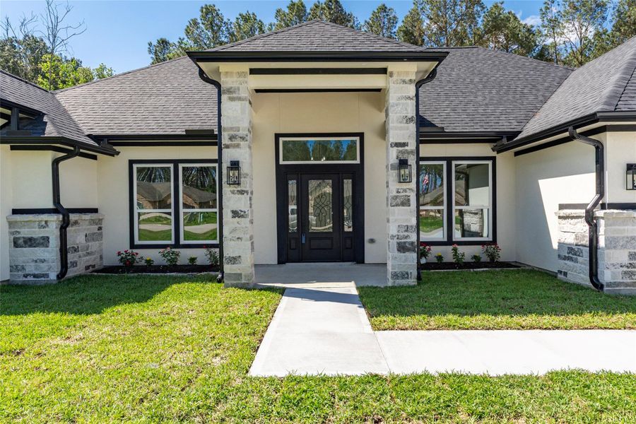 Front exterior of a new home in , Dayton, TX, highlighting curb appeal (Image 26).