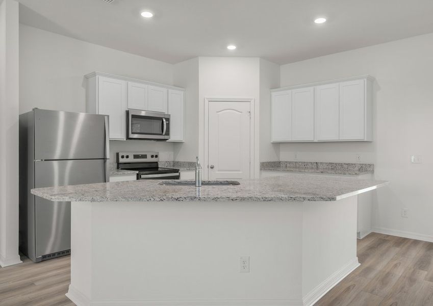 The kitchen has a large island that will be perfect for you and your family to gather around