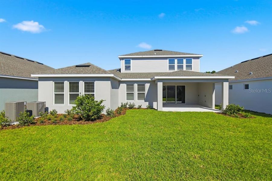 Exterior details and patio area of a home in Harvest at Ovation, Winter Garden (Image 15).