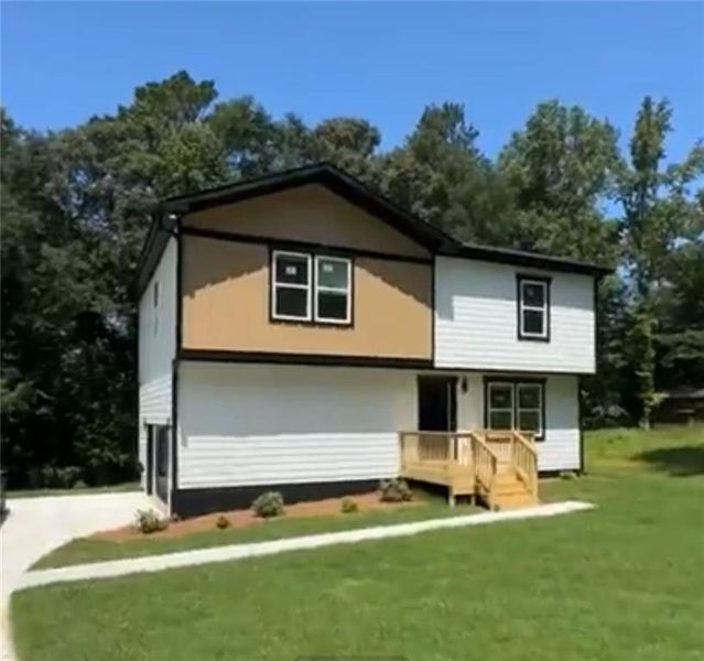 Front exterior of a new home in , Stockbridge, GA, highlighting curb appeal (Image 24). Front exterior of a new home in , Stockbridge, GA, highlighting curb appeal (Image 24).