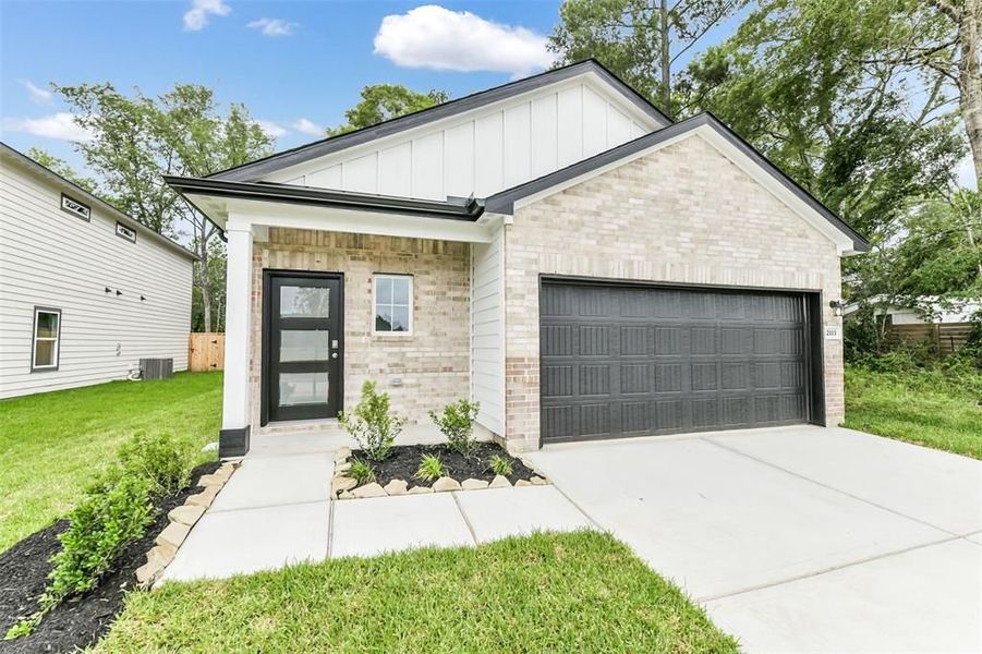 Front exterior of a new home in Caney Creek Place, Conroe, TX, highlighting curb appeal (Image 31).