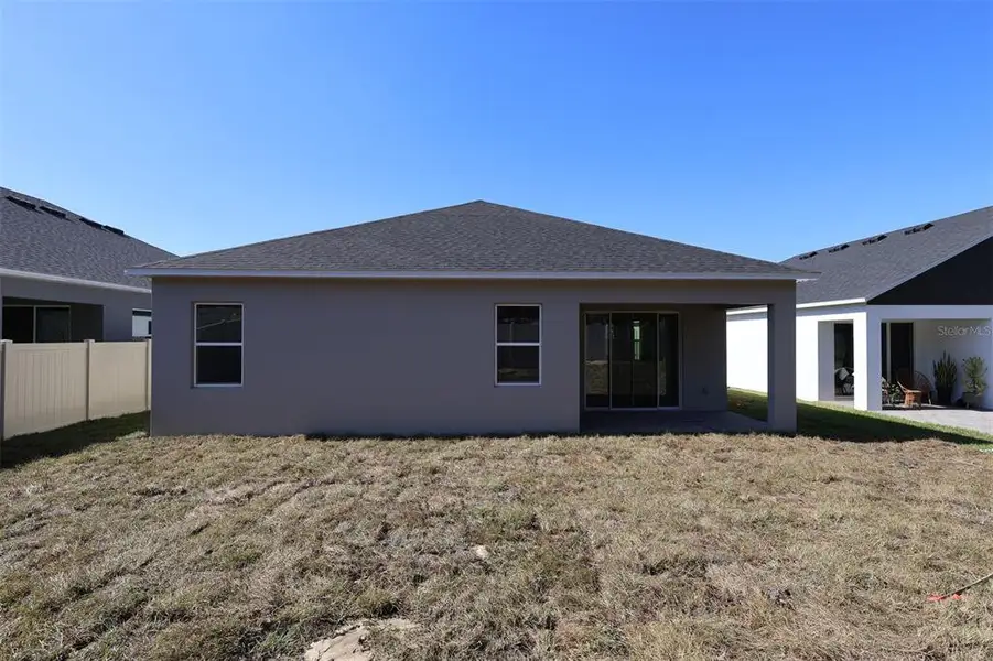 Exterior details and patio area of a home in Emerson Pointe, Apopka (Image 13).