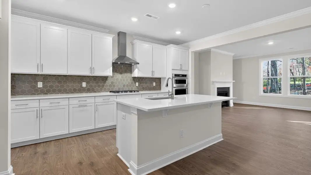 Furnished interior view inside a new home in The Estates Park, Apex (Image 3).