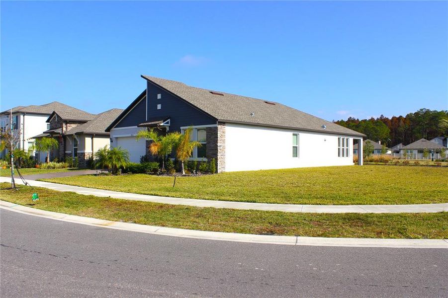 Front exterior of a new home in , Lutz, FL, highlighting curb appeal (Image 21).