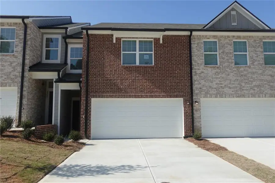 Front exterior of a new home in Kendall Grove, McDonough, GA, highlighting curb appeal (Image 1). Front exterior of a new home in Kendall Grove, McDonough, GA, highlighting curb appeal (Image 1).