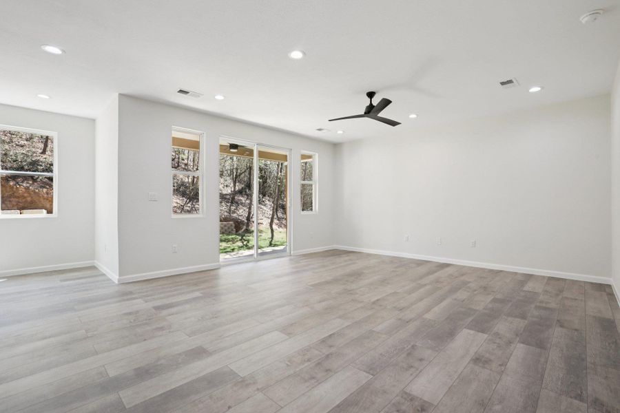 Living Room featuring light wood-type laminate flooring, ceiling fan, and recessed lighting