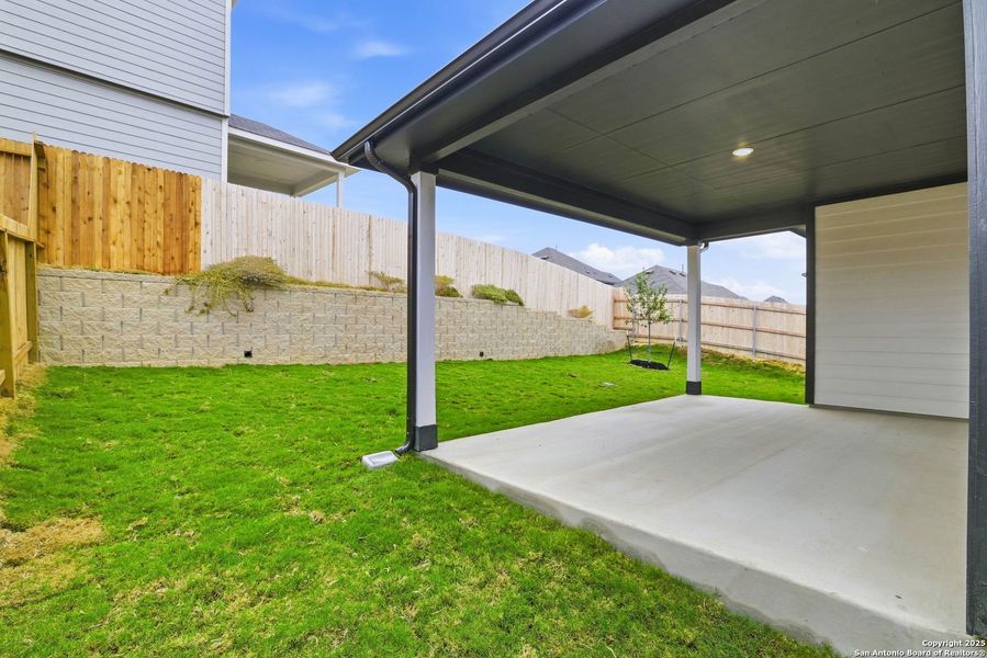 Exterior details and patio area of a home in Vista Ridge, Live Oak (Image 15).