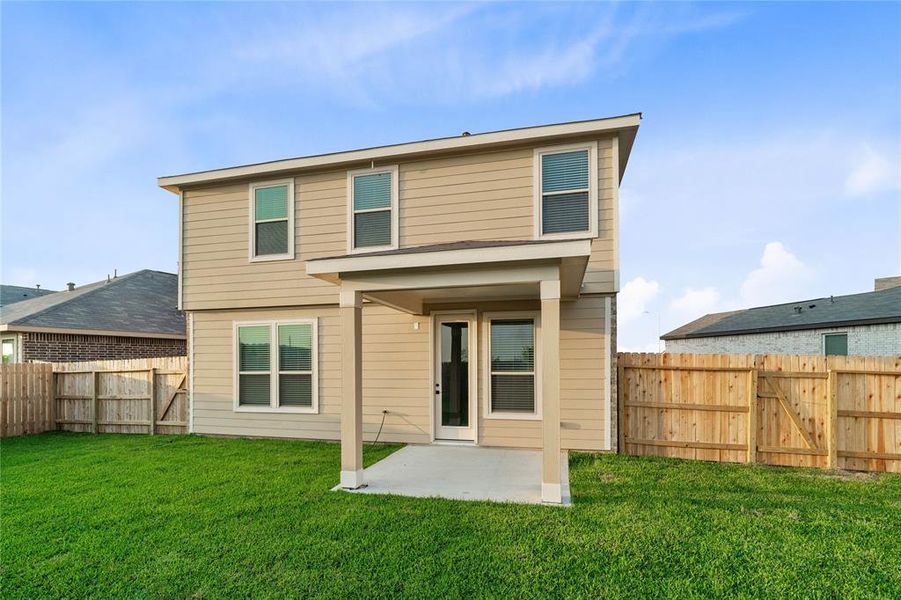 Come and see this spacious backyard with its beautiful covered patio. There is plenty of room for the kids to play and adults to relax!