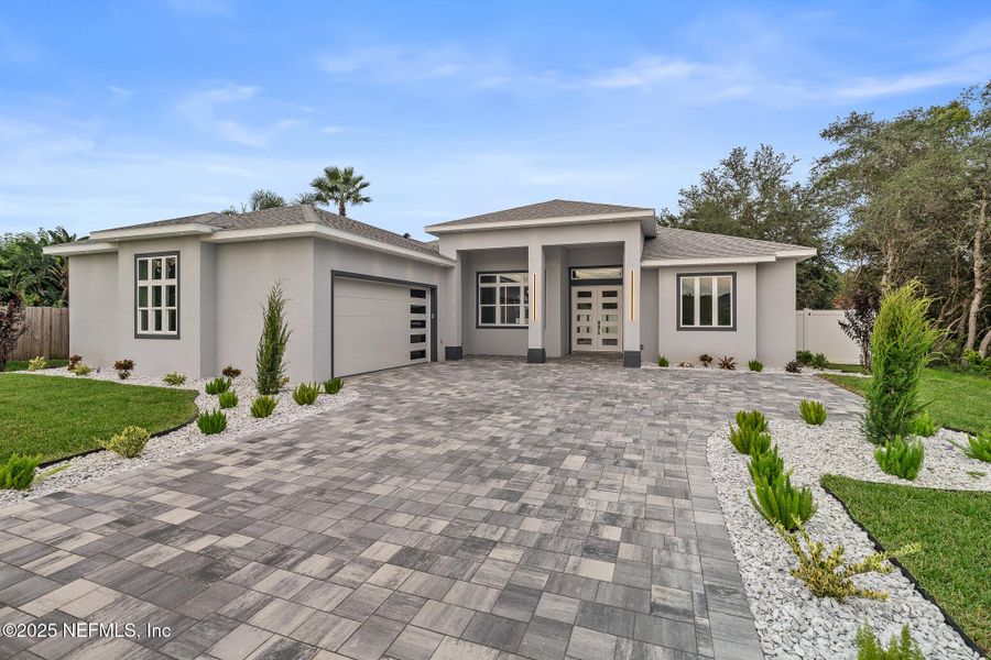 Front exterior of a new home in , Palm Coast, FL, highlighting curb appeal (Image 36). Front exterior of a new home in , Palm Coast, FL, highlighting curb appeal (Image 36).