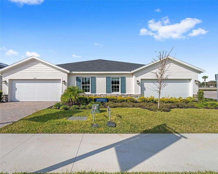 Front exterior of a new home in , Lady Lake, FL, highlighting curb appeal (Image 19). Front exterior of a new home in , Lady Lake, FL, highlighting curb appeal (Image 19).