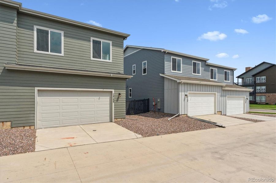 Front exterior of a new home in Paired Homes at Alder Creek, Parker, CO, highlighting curb appeal (Image 1).