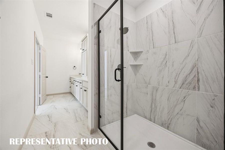 In addition to ample vanity and storage space, you'll enjoy a spacious walk in shower in this dream owner's bath!  REPRESENTATIVE PHOTO