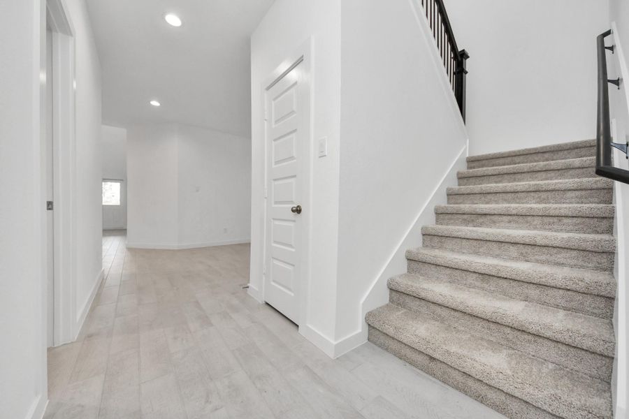 Come upstairs and enjoy a day of leisure in this fabulous game room! This is the perfect hangout spot or adult game room! Features plush carpet, high ceilings, custom paint and windows for plenty of natural light. Sample photo of completed home with similar floor plan. Actual colors and selections may vary.