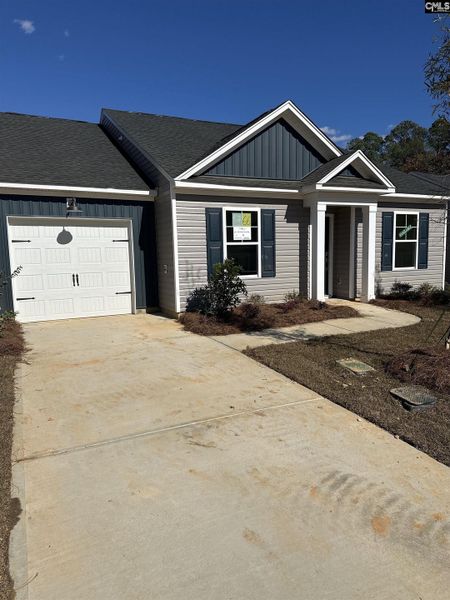 Front exterior of a new home in Piney Woods Bluff, Columbia, SC, highlighting curb appeal (Image 1).