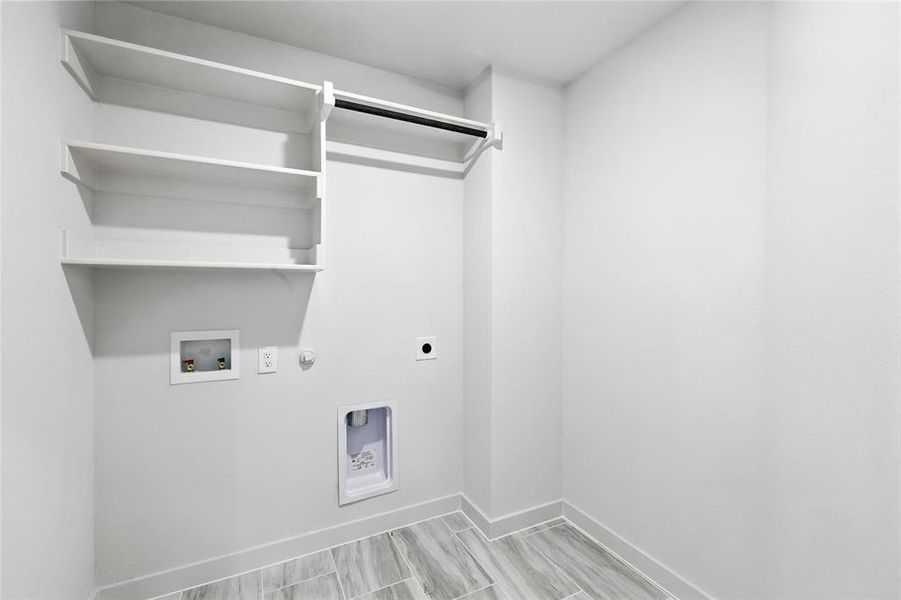 Washroom featuring gas dryer hookup, electric dryer hookup, and washer hookup