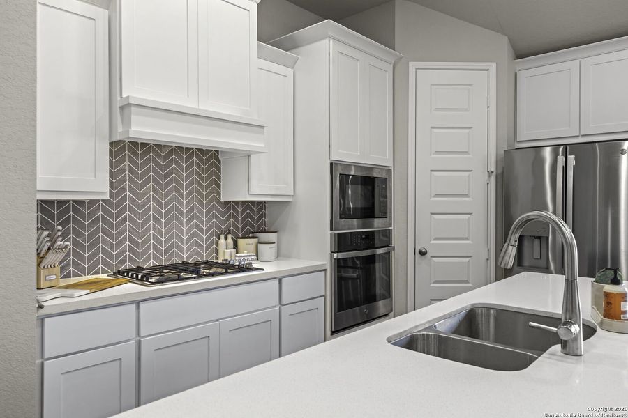 Furnished interior view inside a new home in The Village of Mill Creek 50', Seguin (Image 13).