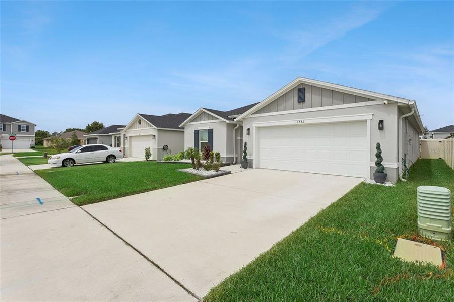 Front exterior of a new home in , St. Cloud, FL, highlighting curb appeal (Image 21).